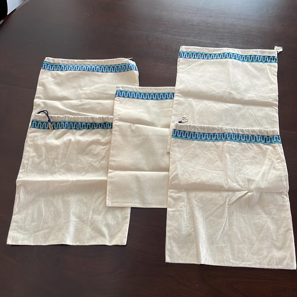 Five Tory Burch storage bags